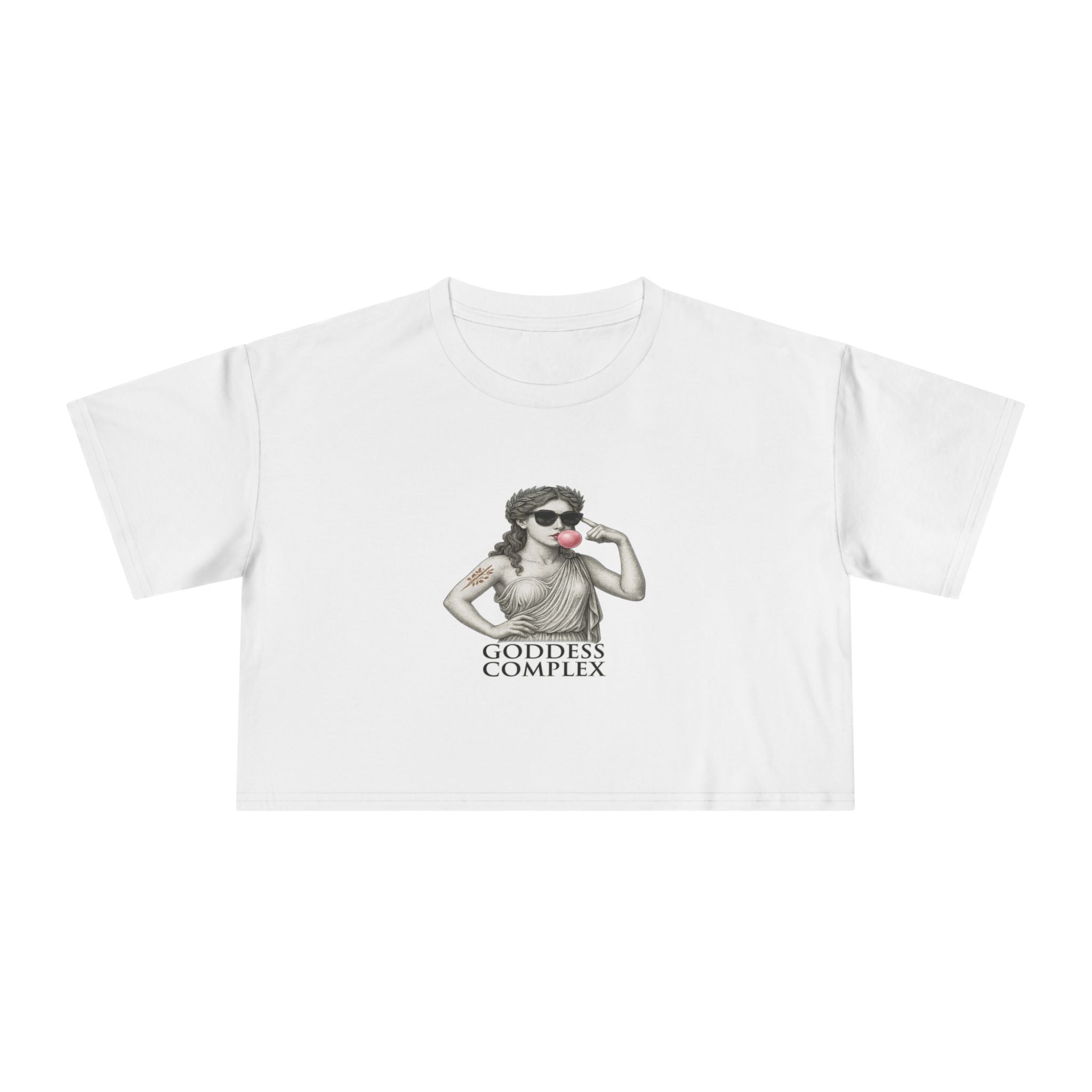 Flatlay of The Goddess Complex crop tee in White, featuring statue blowing bubblegum graphic.
