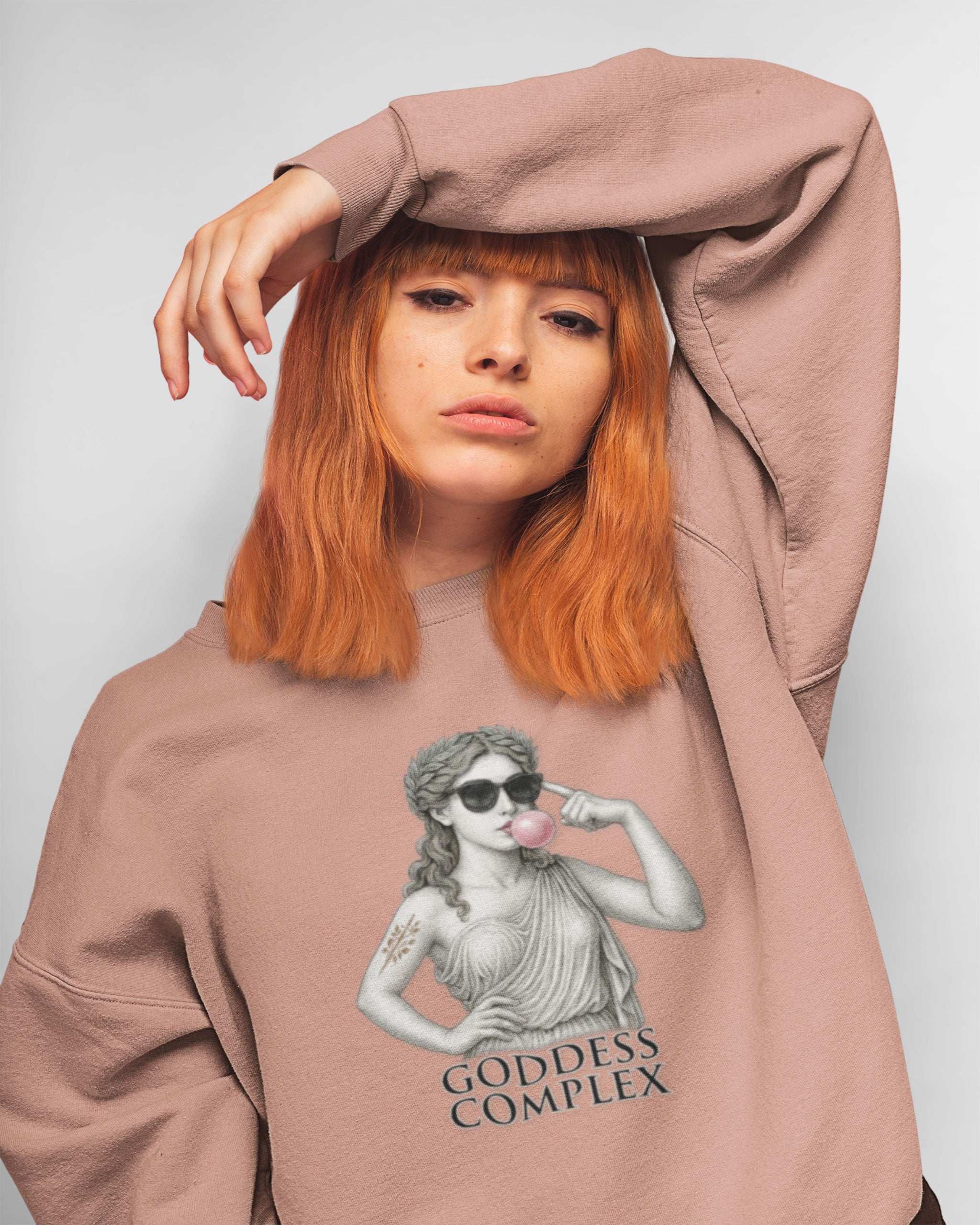 “Roman statue goddess sweatshirt – pink crewneck with bubblegum and sunglasses illustration, 'Goddess Complex' text”